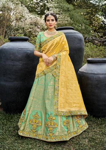 Look Attrective This Wedding Partywear Heavy Designer Lehenga Choli And Dupatta In Fine Color Fabricated On Silk Beautified With Heavy Attractive Wevon Designer,Embroidery,Stone Hand Work. 