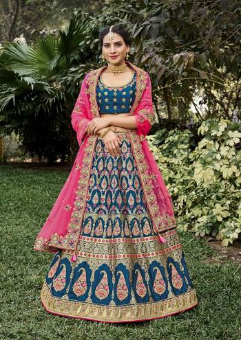 Look Attrective This Wedding Partywear Heavy Designer Lehenga Choli And Dupatta In Fine Color Fabricated On Silk Beautified With Heavy Attractive Wevon Designer,Embroidery,Stone Hand Work. 