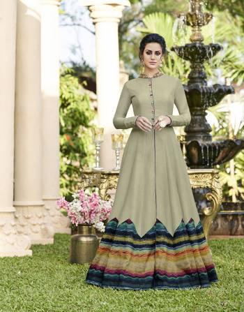 This seaosn Is About Subtle Shades And Pastel Play, So Grab This Designer Gown In Pastel Green Paired With Blue Colored Art Silk Fabricated Pant. Buy Now.