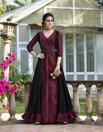 Grab This Designer Gown In Maroon And Black Color Fabricated On Tussar Art Silk Beautified With Prints And Jacket Pattern .It Is Paired with Black Colored Pant Fabricated On Art Silk. 