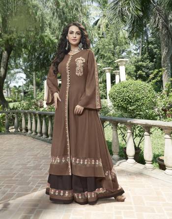 New And Unique Patterned Designer Dress Is Here In Brown Color Paired With A Dark Brown Colored Plaazo. Its Top Anf Bottom Both Are Beautified With Attractive Embroidery With Thread And Jari Work .