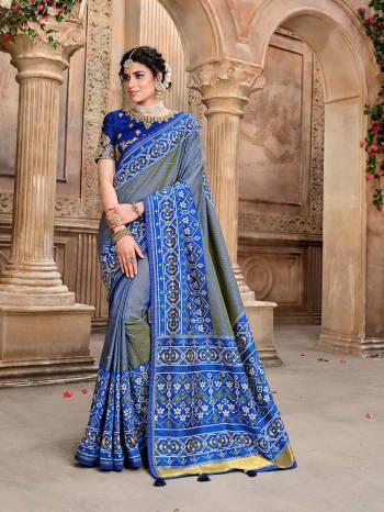 Garb This Pretty Angelic Patan Patola Look Wearing This Heavy Designer Resham Mirror Khatli And Cut Dana Work Saree In Fine Color Paired With 2 Blouse. This Saree And Blouse Is Fabricated On Silk Paired. Its Attractive Look To Your Personality. 