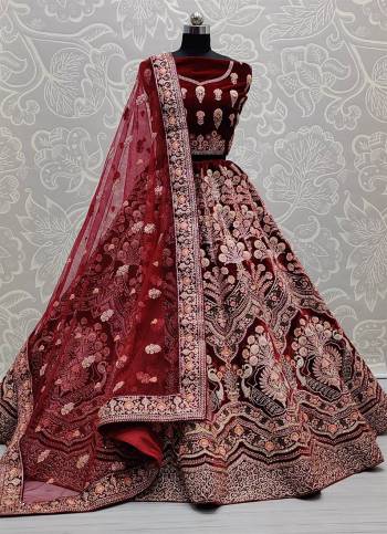 Attrective This Wedding Partywear Heavy Designer Lehenga Choli And Dupatta In Fine Color Fabricated On Velvet Beautified With Heavy Attractive Designer Embroidery And Zarkan Diamond Work. 