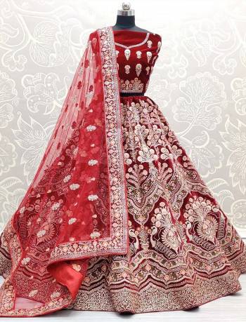 Attrective This Wedding Partywear Heavy Designer Lehenga Choli And Dupatta In Fine Color Fabricated On Velvet Beautified With Heavy Attractive Designer Embroidery And Zarkan Diamond Work. 