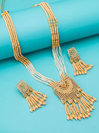 Attrective Look To Your Personality By Pairing Up This Beautiful Necklace Set With Your Ethnic Attire. This Pretty Set Is In Gold Color Beautified With Kundan Work. Buy Now.