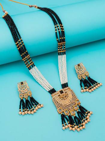 Attrective Look To Your Personality By Pairing Up This Beautiful Necklace Set With Your Ethnic Attire. This Pretty Set Is In Black Color Beautified With Kundan Work. Buy Now.