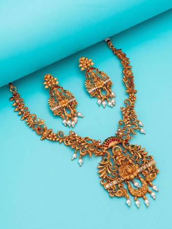 Attrective Look To Your Personality By Pairing Up This Beautiful Necklace Set With Your Ethnic Attire. This Pretty Set Is In Gold Color Beautified With Temple Work. Buy Now.