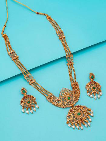 Attrective Look To Your Personality By Pairing Up This Beautiful Necklace Set With Your Ethnic Attire. This Pretty Set Is In Gold Color Beautified With Temple Work. Buy Now.