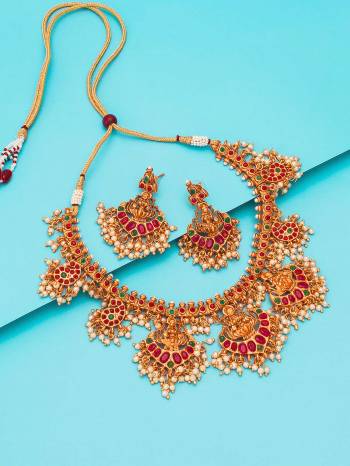 Attrective Look To Your Personality By Pairing Up This Beautiful Necklace Set With Your Ethnic Attire. This Pretty Set Is In Gold Color Beautified With Temple Work. Buy Now.