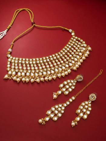 Attrective Look To Your Personality By Pairing Up This Beautiful Necklace Set With Your Ethnic Attire. This Pretty Set Is In Gold Color Beautified With Kundan Work. Buy Now.