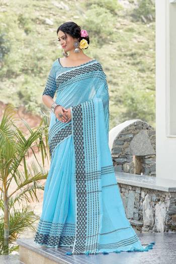 Garb This Partywear Saree Are Fine Saree Paired With Blouse.This Saree And Blouse Are Linen Based Fabric With Wevon Designer Work. Buy This Pretty Saree Now.