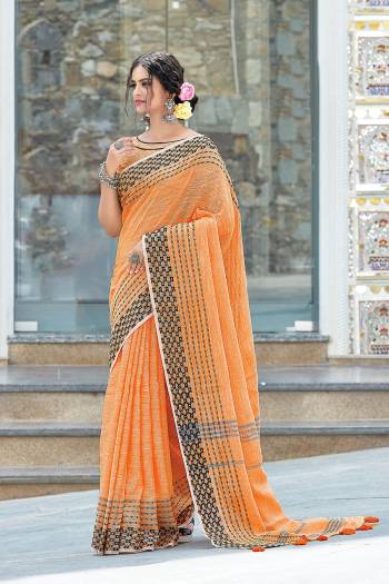 Garb This Partywear Saree Are Fine Saree Paired With Blouse.This Saree And Blouse Are Linen Based Fabric With Wevon Designer Work. Buy This Pretty Saree Now.