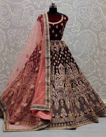 Stylist This Wedding Partywear Heavy Designer Lehenga Choli And Dupatta In Fine Color Fabricated On Velvet Beautified With Heavy Attractive Designer Embroidery And Zarkan Diamond Work. 