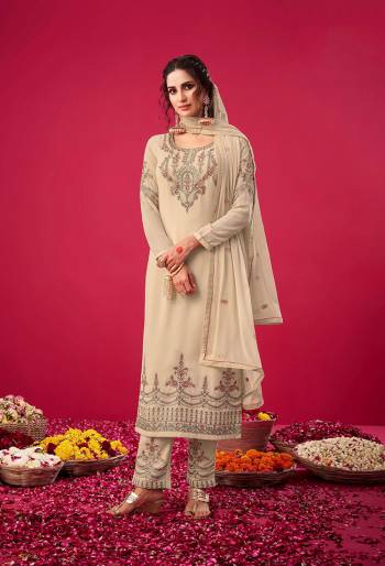 Garb This Designer Suit In Lovely Color.Its Pretty Heavy Designer Thread,Jari Embroidery Work Top Is Georgette Based Paired With Santoon Bottom And Naznin Fabricated Dupatta Which Gives An Attractive To The Suit.