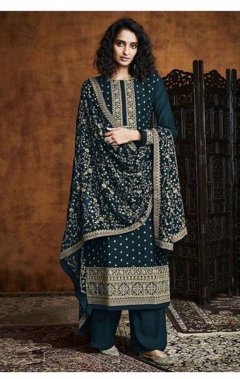 Garb This Designer Pakistani Suit In Lovely Color.Its Pretty Heavy Designer Sequance Embroidery Work Top Is Faux Georgette Based Paired With Santoon Bottom And Faux Georgette Fabricated Dupatta Which Gives An Attractive To The Suit.