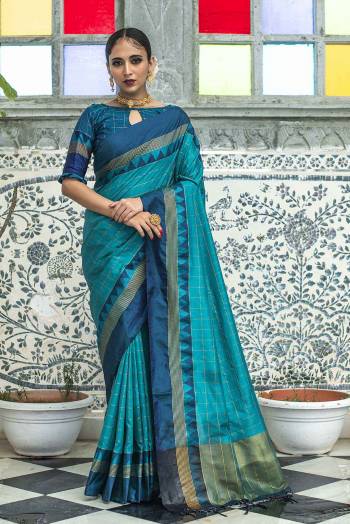 Stylist Looking This Fastival Saree Are Fine Saree Paired With Blouse.This Saree And Blouse Are Fancy Raw Silk Based Fabric With Designer Wevon Cheks And Temple Work. Buy This Pretty Saree Now.