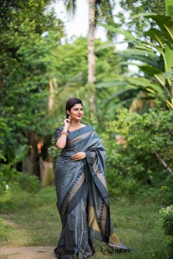 Stylist Looking This Fastival Saree Are Fine Saree Paired With Blouse.This Saree And Blouse Are Fancy Raw Silk Based Fabric With Designer Wevon Cheks And Temple Work. Buy This Pretty Saree Now.