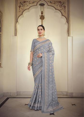 Stylist This Partywear Saree Are Fine Saree Paired With Blouse.This Saree And Blouse Are Fancy Based Fabric With Fancy Designer Embroidery Work. Buy This Pretty Saree Now.