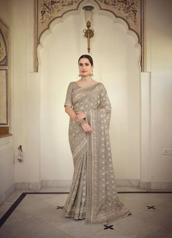 Stylist This Partywear Saree Are Fine Saree Paired With Blouse.This Saree And Blouse Are Fancy Based Fabric With Fancy Designer Embroidery Work. Buy This Pretty Saree Now.