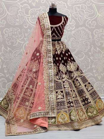 Stylist This Wedding Partywear Heavy Designer Lehenga Choli And Dupatta In Fine Color Fabricated On Velvet Beautified With Heavy Attractive Designer Embroidery And Zarkan Diamond Work. 