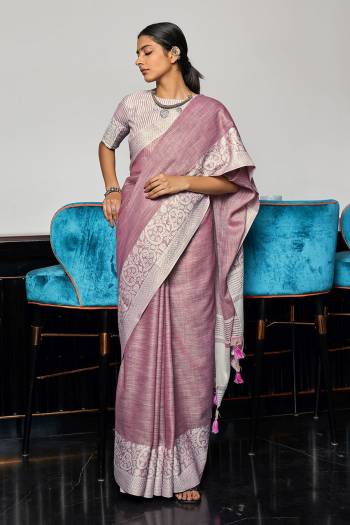 Garb This Traditional Saree Are Fine Saree Paired With Blouse.This Saree And Blouse Are Linen Based Fabric With Wevon Designer Pallu Border Work. Buy This Pretty Saree Now.