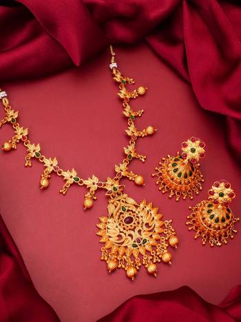 Heavy Looking To Your Personality By Pairing Up This Beautiful Necklace Set With Your Ethnic Attire. This Prtty Set Is In Gold Color Beautified With Temple Work. Buy Now.