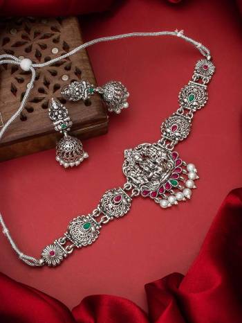 Heavy Looking To Your Personality By Pairing Up This Beautiful Necklace Set With Your Ethnic Attire. This Prtty Set Is In Silver Color Beautified With Temple Work. Buy Now.