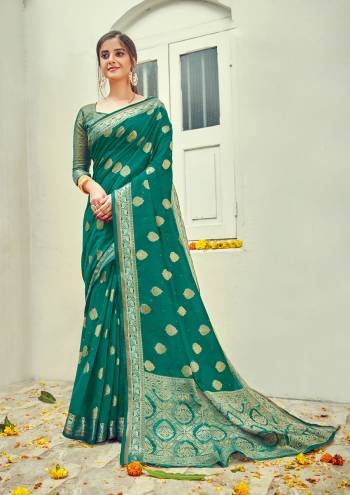 Garb This Designer Partywear Saree Are Fine Saree Paired With Blouse.This Saree And Blouse Are Cotton Based Fabric With Wevon Designer Work. Buy This Pretty Saree Now.