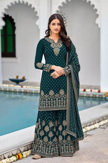 Attrective This Designer Pakistani Sharara Suit In Lovely Color.Its Pretty Heavy Designer Sequance Embroidery Work Top Is Faux Georgette Based Paired With Faux Georgette Bottom And Faux Georgette Fabricated Dupatta Which Gives An Attractive To The Suit.