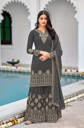 Attrective This Designer Pakistani Sharara Suit In Lovely Color.Its Pretty Heavy Designer Sequance Embroidery Work Top Is Faux Georgette Based Paired With Faux Georgette Bottom And Faux Georgette Fabricated Dupatta Which Gives An Attractive To The Suit.