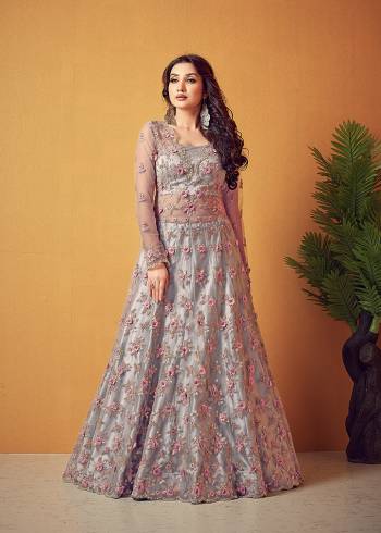 Flaunt Your Rich And Elegant Taste Wearing This Designer Long Gown With Dupatta In Light Color. This  Pretty Gown And Dupatta Is Fabricated On Super Net Beautified With Heavy Thread Embroidery With Diamond Work. Its Fabric Is Soft Towards Skin And Easy To Carry All Day Long. 