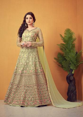 Flaunt Your Rich And Elegant Taste Wearing This Designer Long Gown With Dupatta In Light Color. This  Pretty Gown And Dupatta Is Fabricated On Super Net Beautified With Heavy Thread Embroidery With Diamond Work. Its Fabric Is Soft Towards Skin And Easy To Carry All Day Long. 