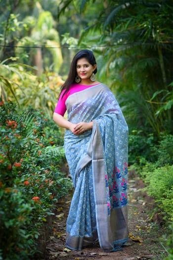 Looking This Designer Partywear Saree Are Fine Saree Paired With Blouse.This Saree And Blouse Are Linen Based Fabric With Heavy Weaving Designer Work. Buy This Pretty Saree Now.