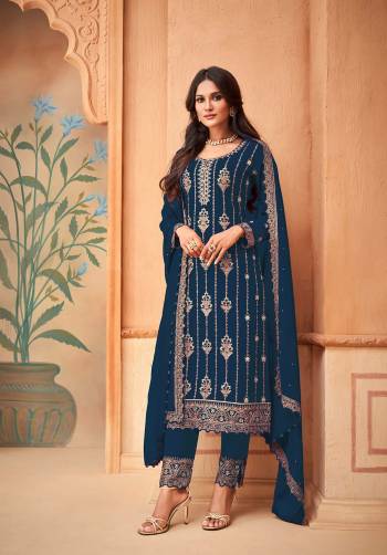 Garb This Designer Long Suit In Lovely Color.Its Pretty Heavy Designer Embroidery Work Top Is Faux Georgette Based Paired With Santoon Bottom And Faux Georgette Fabricated Dupatta Which Gives An Attractive To The Suit.