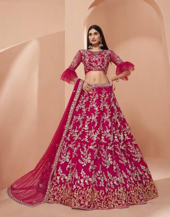 Garb This Wedding Special Designer Lehenga Choli And Dupatta In Fine Color. Blouse Are Fabricated On Net And Lahenga Are Net Beautified With Dupatta Are Net Fabric With Thread,Jari,Sequance Embroidery Work. 