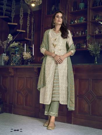 Attrective This Designer Long Length Suit In Lovely Color.Its Pretty Heavy Designer Embroidery Work Top Is Art Silk Based Paired With Russian Silk Bottom And Cotton Fabricated Dupatta Which Gives An Attractive To The Suit.