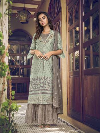 Attrective This Designer Long Length Suit In Lovely Color.Its Pretty Heavy Designer Embroidery Work Top Is Art Silk Based Paired With Cotton Bottom And Cotton Fabricated Dupatta Which Gives An Attractive To The Suit.