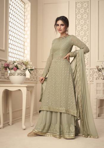 Attrective This Designer Long Length Suit In Lovely Color.Its Pretty Heavy Designer Embroidery,Swarovski Work Top Is Georgette Based Paired With Santoon Bottom And Georgette Fabricated Dupatta Which Gives An Attractive To The Suit.