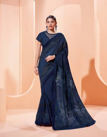 Garb This Partywear Stylist Designer Fine Colour Saree Paired With Blouse.This Saree Are Lycra And Blouse Are Raw Silk Fabric With Heavy Designer Embroidery Work. Buy This Pretty Saree Now.