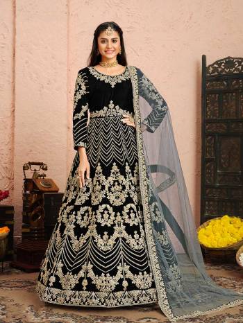 Stylist This Partywear Designer Long Length Suit In Lovely Color.Its Pretty Heavy Designer Embroidery Work Top Is Velvet Based Paired With Santoon Bottom And Net Fabricated Dupatta Which Gives An Attractive To The Suit.