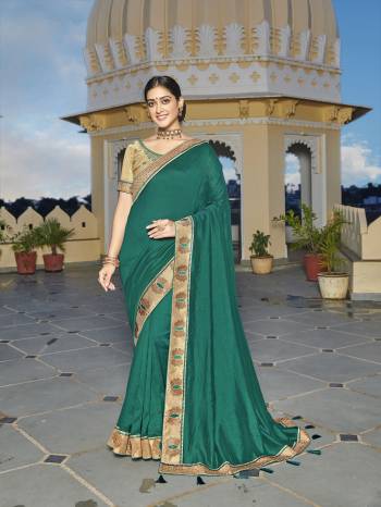 Looking This Designer Partywear Saree Are Fine Saree Paired With Blouse.This Saree Are Vichitra Silk And Blouse Phantom Silk Based Fabric With Heavy Designer Embroidery,Swarovski Work Work. Buy This Pretty Saree Now.