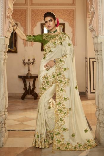 Garb This Stylist Partywear Saree Are Fine Saree Paired With Blouse.This Saree Are Viscose With Golden Smoke And Blouse Are Raw Silk Fabric With Heavy Designer Embroidery Work With Beads. Buy This Pretty Saree Now.