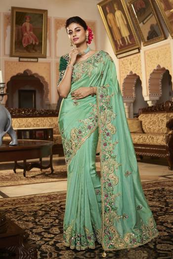 Garb This Stylist Partywear Saree Are Fine Saree Paired With Blouse.This Saree Are Viscose With Golden Smoke And Blouse Are Raw Silk Fabric With Heavy Designer Embroidery Work With Beads. Buy This Pretty Saree Now.