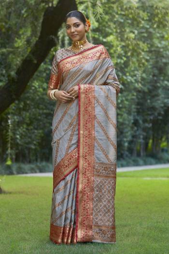 Garb This Designer Partywear Saree Are Fine Saree Paired With Blouse.This Saree And Blouse Are Silk Based Fabric With Wevon Designer Work. Buy This Pretty Saree Now.