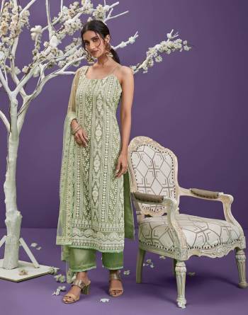 Attrective This Designer Lacknowi Long Length Suit In Lovely Light Color.Its Pretty Heavy Designer Cotton Thread,Sequance Embroidery Work Top Is Net Based Paired With Banglori Silk Bottom And Net Fabricated Dupatta Which Gives An Attractive To The Suit.