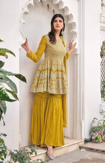 Attrective This Designer Sharara Suit In Lovely Color.Its Pretty Heavy Designer Embroidery Work Top Is Viscose Georgette Based Paired With Viscose Georgette Bottom And Soft Net Fabricated Dupatta Which Gives An Attractive To The Suit.