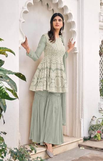 Attrective This Designer Sharara Suit In Lovely Color.Its Pretty Heavy Designer Embroidery Work Top Is Viscose Georgette Based Paired With Viscose Georgette Bottom And Soft Net Fabricated Dupatta Which Gives An Attractive To The Suit.