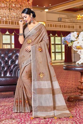 Looking Traditional This Partywear Saree Are Fine Color Paired With Blouse.This Saree And Blouse Are Linen Based Fabric With Wevon Designer With Mirror Embroidery Work. Buy This Pretty Saree Now.