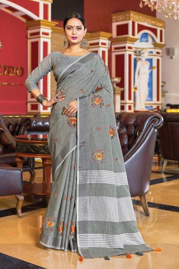 Looking Traditional This Partywear Saree Are Fine Color Paired With Blouse.This Saree And Blouse Are Linen Based Fabric With Wevon Designer With Mirror Embroidery Work. Buy This Pretty Saree Now.