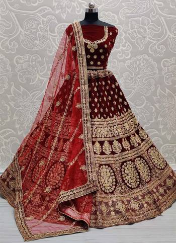 Attrective This Wedding Partywear Heavy Designer Lehenga Choli And Dupatta In Fine Color Fabricated On Velvet Beautified With Heavy Attractive Designer Embroidery And Zarkan Diamond Work. 